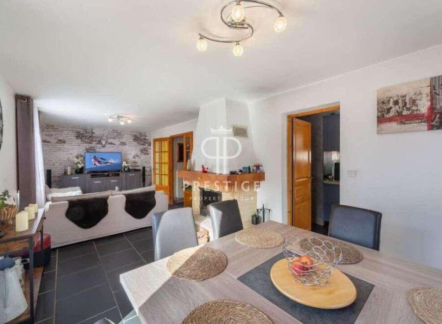 Discover this stunning property featuring a spacious living area with a cozy fireplace, perfect for relaxing evenings.