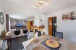 Discover this stunning property featuring a spacious living area with a cozy fireplace, perfect for relaxing evenings.