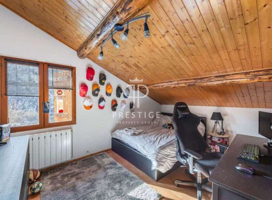 Discover a cozy attic bedroom with a unique design.