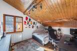 Discover a cozy attic bedroom with a unique design.