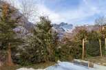 Discover a stunning property nestled in a picturesque mountain setting.