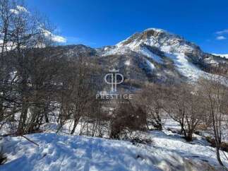 Discover a stunning property nestled in a picturesque mountain landscape.