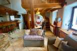 Discover the charm of this unique property, featuring a cozy interior with exposed wooden beams and a rustic aesthetic.
