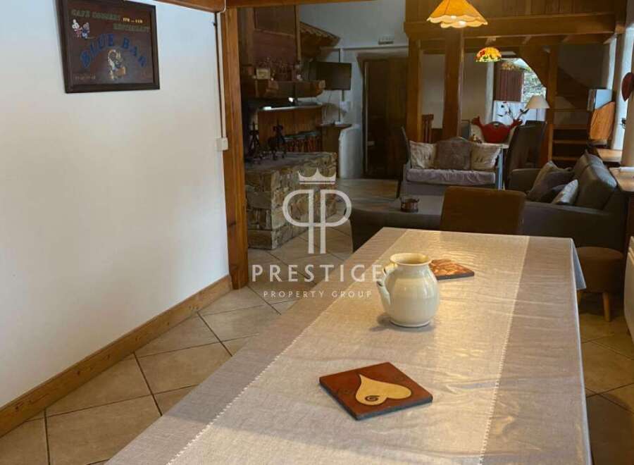 Discover the charm of this property, featuring a cozy dining area perfect for gatherings.