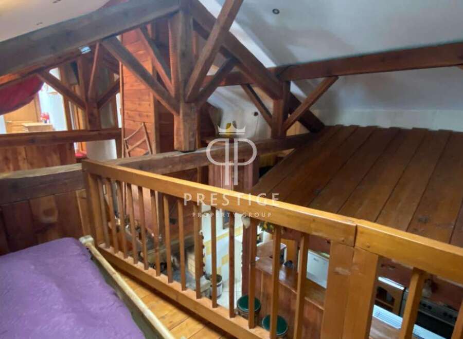 Discover the charm of this unique property, featuring stunning wooden beams and a cozy loft space.