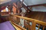 Discover the charm of this unique property, featuring stunning wooden beams and a cozy loft space.