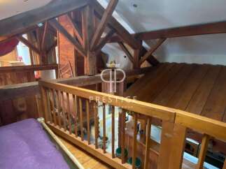 Discover the charm of this unique property, featuring stunning wooden beams and a cozy loft space.