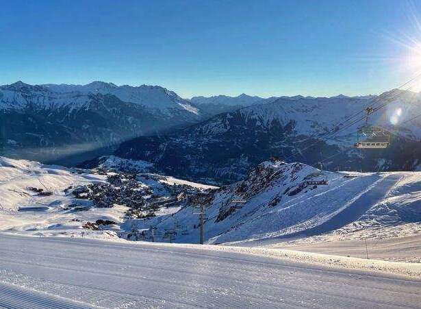Enjoy breathtaking mountain views and pristine ski slopes in this stunning winter landscape.