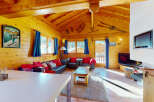 Experience the charm of a cozy wooden cabin, perfect for a mountain getaway.