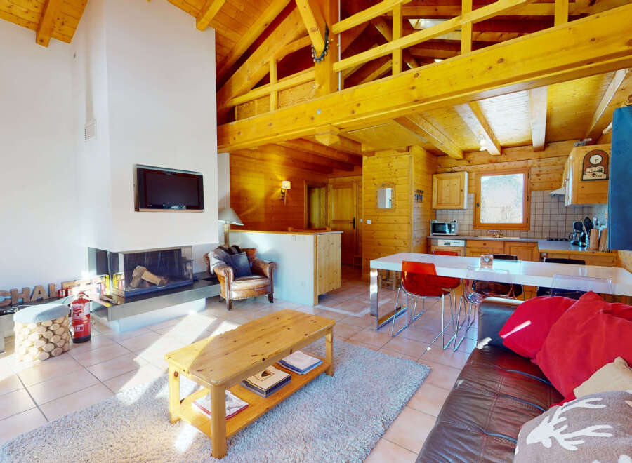 Experience the charm of this cozy chalet, featuring a stunning wooden interior and a warm, inviting atmosphere.