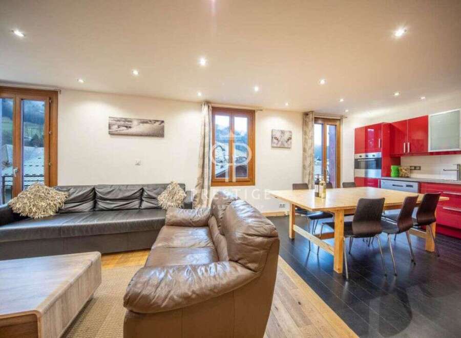 Discover a stunning living space with a modern kitchen and dining area.