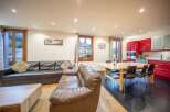 Discover a stunning living space with a modern kitchen and dining area.