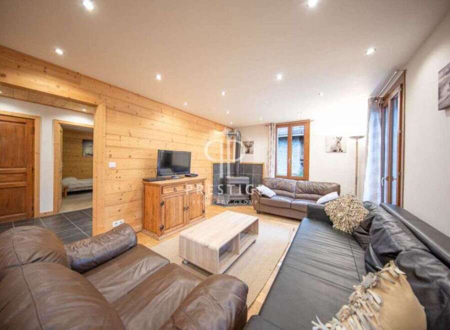 Discover the charm of this cozy living space, featuring warm wooden accents and a welcoming atmosphere.