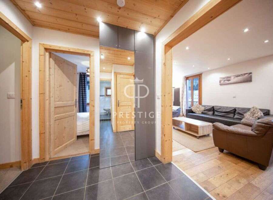 Discover the charm of this property, featuring a warm and inviting interior with wooden accents throughout.