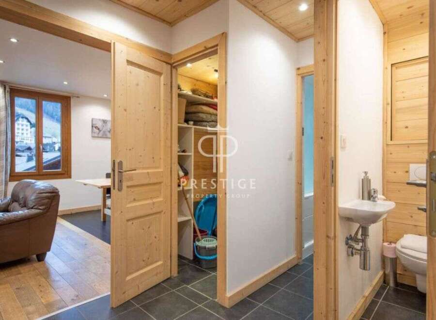 Discover the charm of this property, featuring a warm and inviting interior with wooden accents throughout.