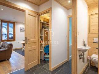 Discover the charm of this property, featuring a warm and inviting interior with wooden accents throughout.