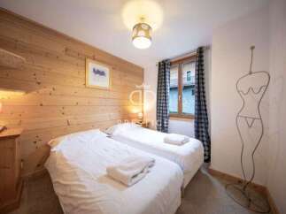 This cozy bedroom features two comfortable twin beds, perfect for a relaxing stay.