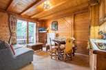 Experience the charm of this cozy wooden chalet, perfect for a relaxing getaway.