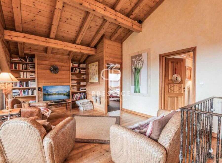 Step into a cozy haven with this stunning property, boasting a warm and inviting wooden interior.