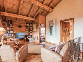 Step into a cozy haven with this stunning property, boasting a warm and inviting wooden interior.