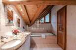 Discover luxury living in this stunning property! Featuring a beautifully designed bathroom with a unique wooden ceiling and elegant fixtures.