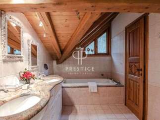 Discover luxury living in this stunning property! Featuring a beautifully designed bathroom with a unique wooden ceiling and elegant fixtures.