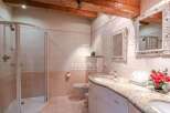 Discover luxury living in this stunning property! Featuring a beautifully designed bathroom with elegant mirrors and a spacious shower.