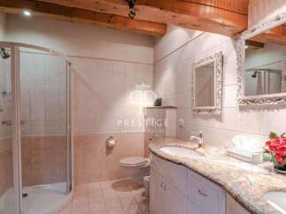 Discover luxury living in this stunning property! Featuring a beautifully designed bathroom with elegant mirrors and a spacious shower.