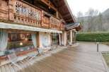 Discover the charm of this exquisite wooden chalet, boasting intricate architectural details and a warm, inviting ambiance.