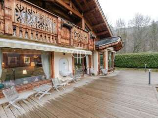 Discover the charm of this exquisite wooden chalet, boasting intricate architectural details and a warm, inviting ambiance.
