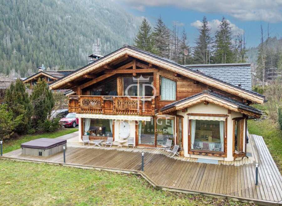 Discover a stunning wooden chalet nestled in a picturesque mountain setting.