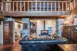 Discover the charm of this rustic property, featuring a cozy fireplace and exposed wooden beams.