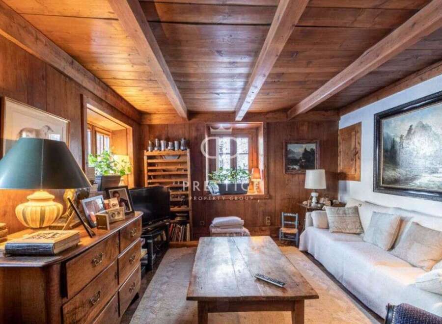 Step into a cozy retreat with this charming property, featuring warm wooden interiors and a rustic ambiance.