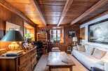 Step into a cozy retreat with this charming property, featuring warm wooden interiors and a rustic ambiance.