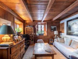 Step into a cozy retreat with this charming property, featuring warm wooden interiors and a rustic ambiance.