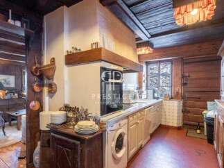 Step into a charming kitchen with rustic wooden accents and a cozy atmosphere.