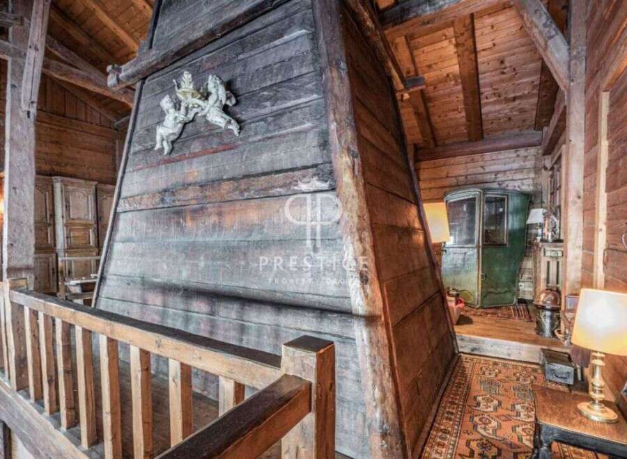 Discover the rustic charm of this unique property, featuring stunning wooden architecture and a cozy ambiance.