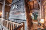 Discover the rustic charm of this unique property, featuring stunning wooden architecture and a cozy ambiance.