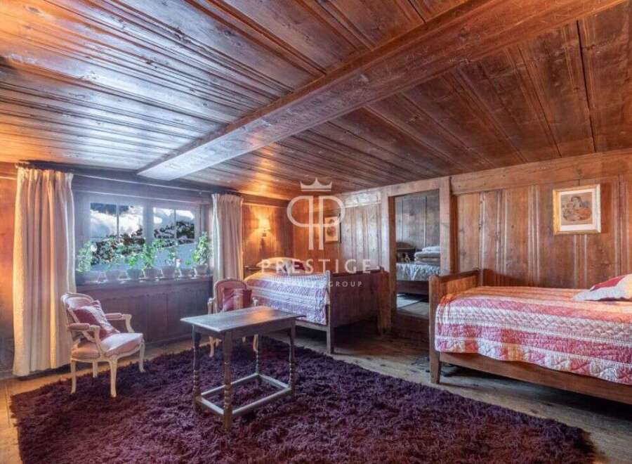 Step into a cozy bedroom retreat with rustic wooden accents.