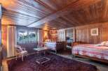 Step into a cozy bedroom retreat with rustic wooden accents.