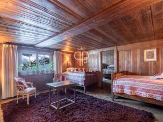 Step into a cozy bedroom retreat with rustic wooden accents.