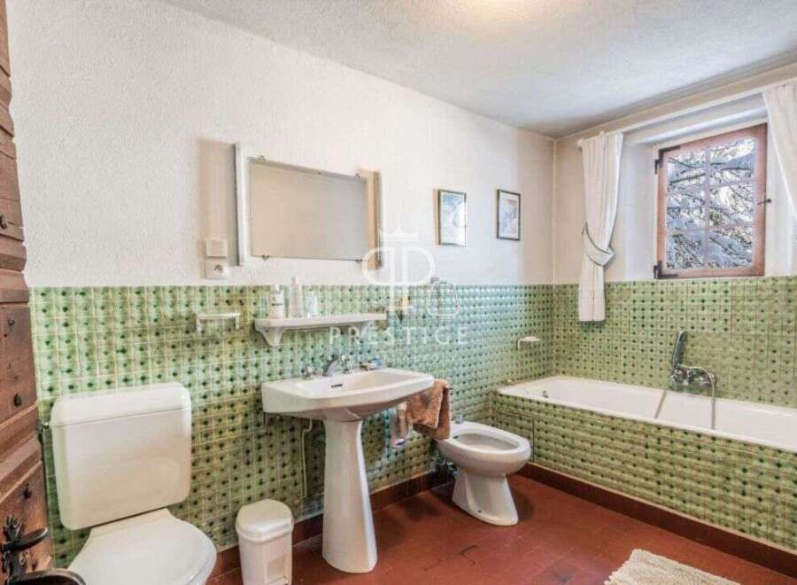 Step into this charming bathroom, featuring a classic design with a touch of vintage flair.