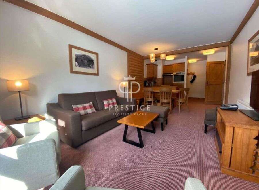 Discover a cozy living space with a comfortable sofa and inviting armchairs.