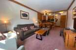 Discover a cozy living space with a comfortable sofa and inviting armchairs.