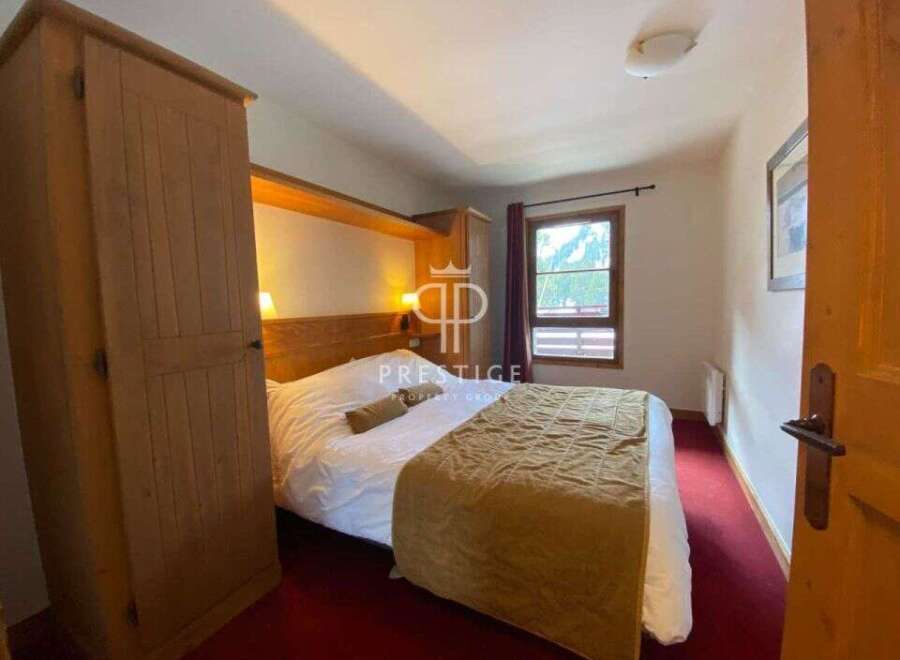 Discover a cozy bedroom with a comfortable bed, perfect for relaxation.