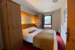 Discover a cozy bedroom with a comfortable bed, perfect for relaxation.