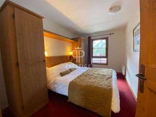 Discover a cozy bedroom with a comfortable bed, perfect for relaxation.