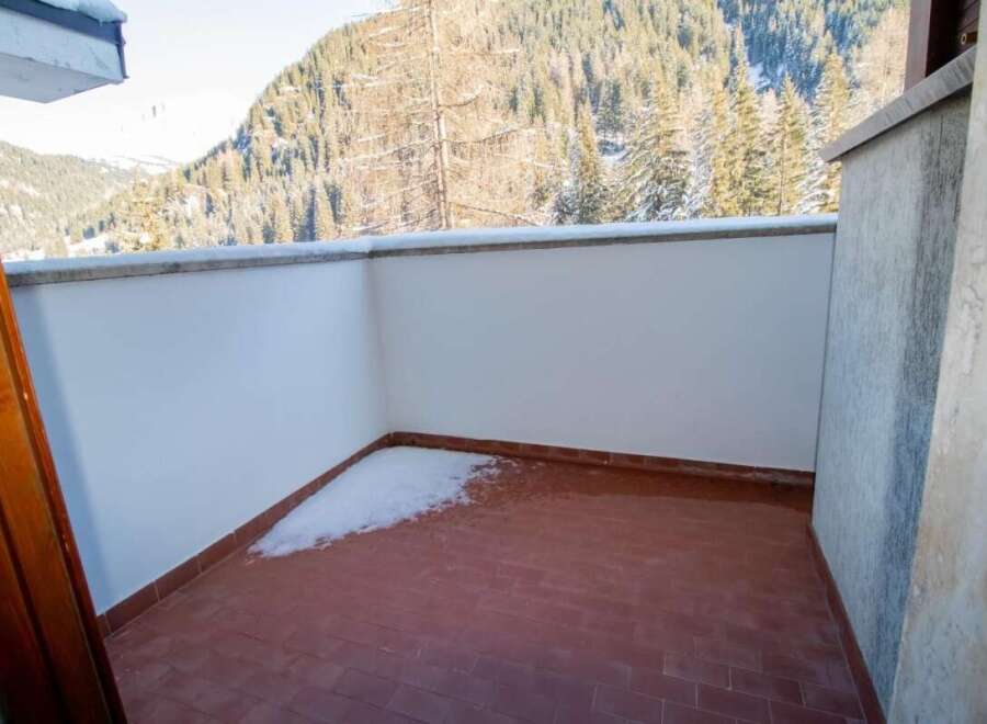 Enjoy breathtaking mountain views from this charming balcony.
