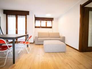 Discover a bright and airy living space with beautiful wooden floors.