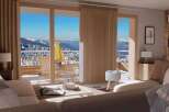 Experience breathtaking mountain views from this cozy living space.